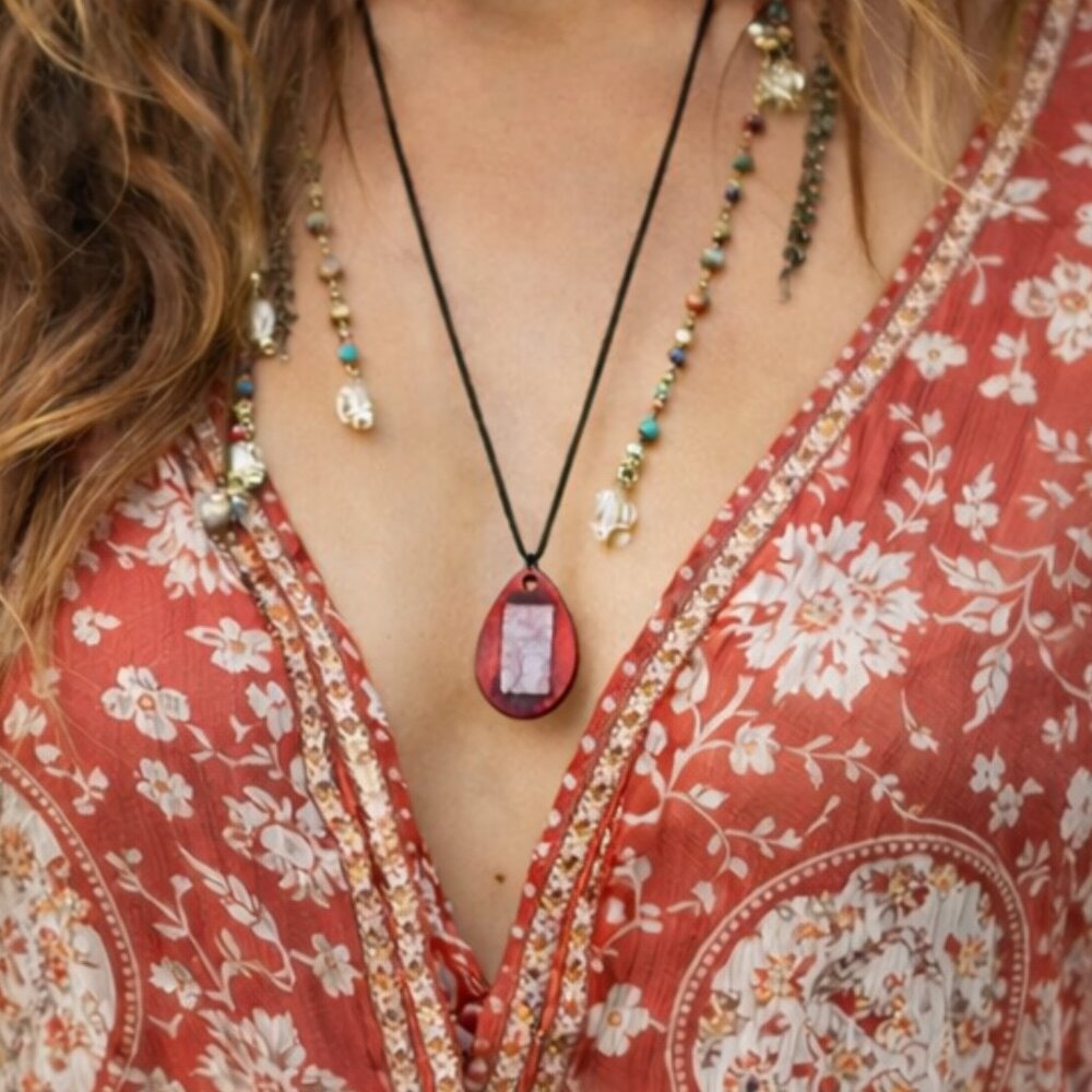 Bohemian necklace with a Zen figure made of wood and fused blue glass